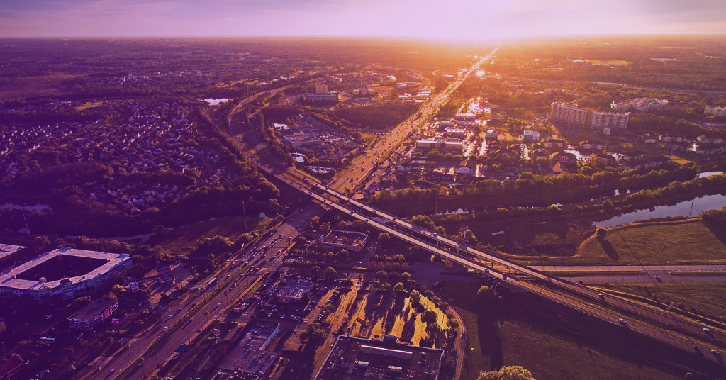 Aerial view of sunset over Kissimmee, Florida showing major roadways and Osceola County’s transportation network.